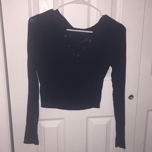 Cross cross lace front shirt from Fashion Nova